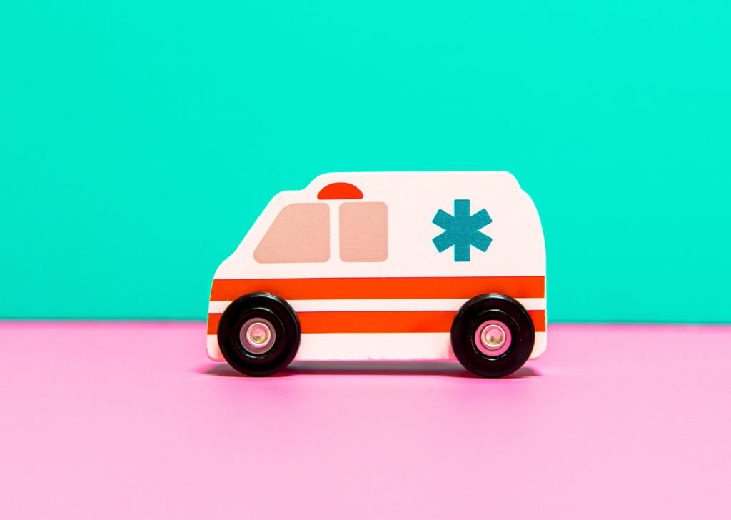 Illustrsation showing a wooden toy ambulance.